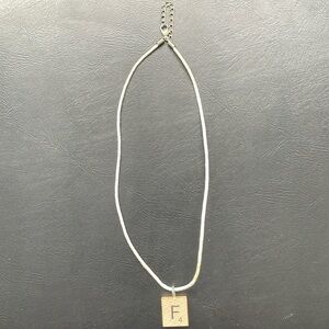 Casual necklace with wooden pendant featuring “F” great for families and friends